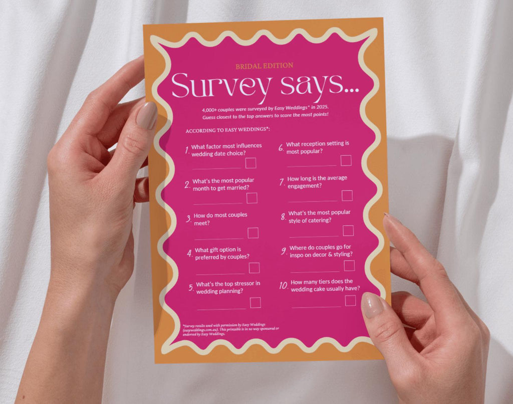 One bridal family feud game card held by two hands against a white background.
