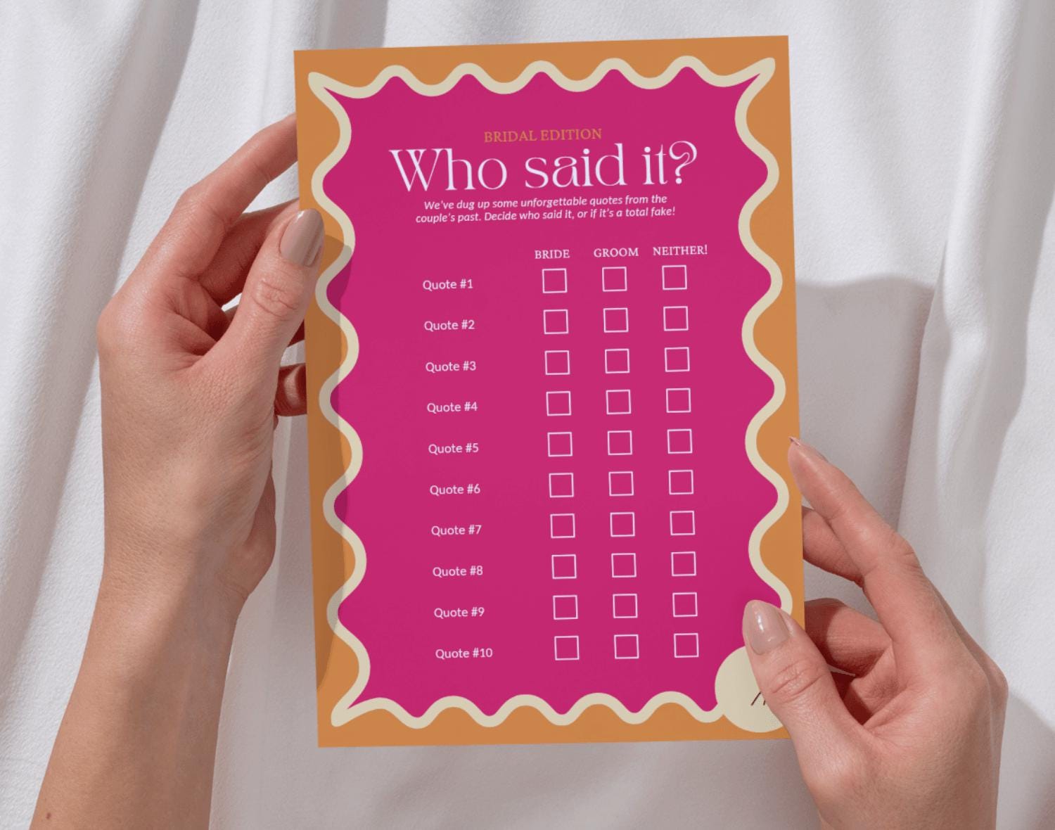 One 'who said it' bachelorette party game sheet held by two hands against a white background.