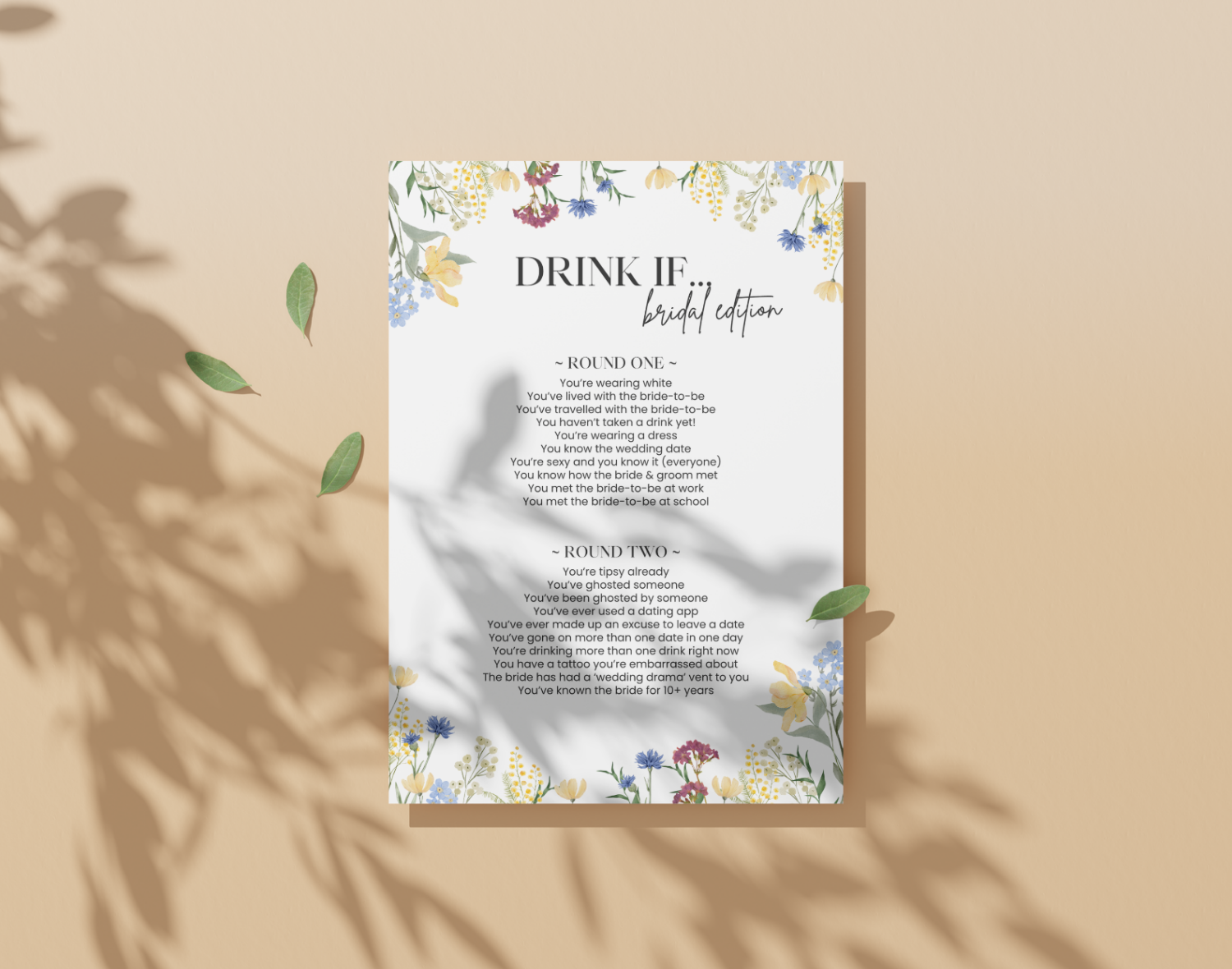 Floral-themed 'Drink If' bachelorette party game card on a beige background