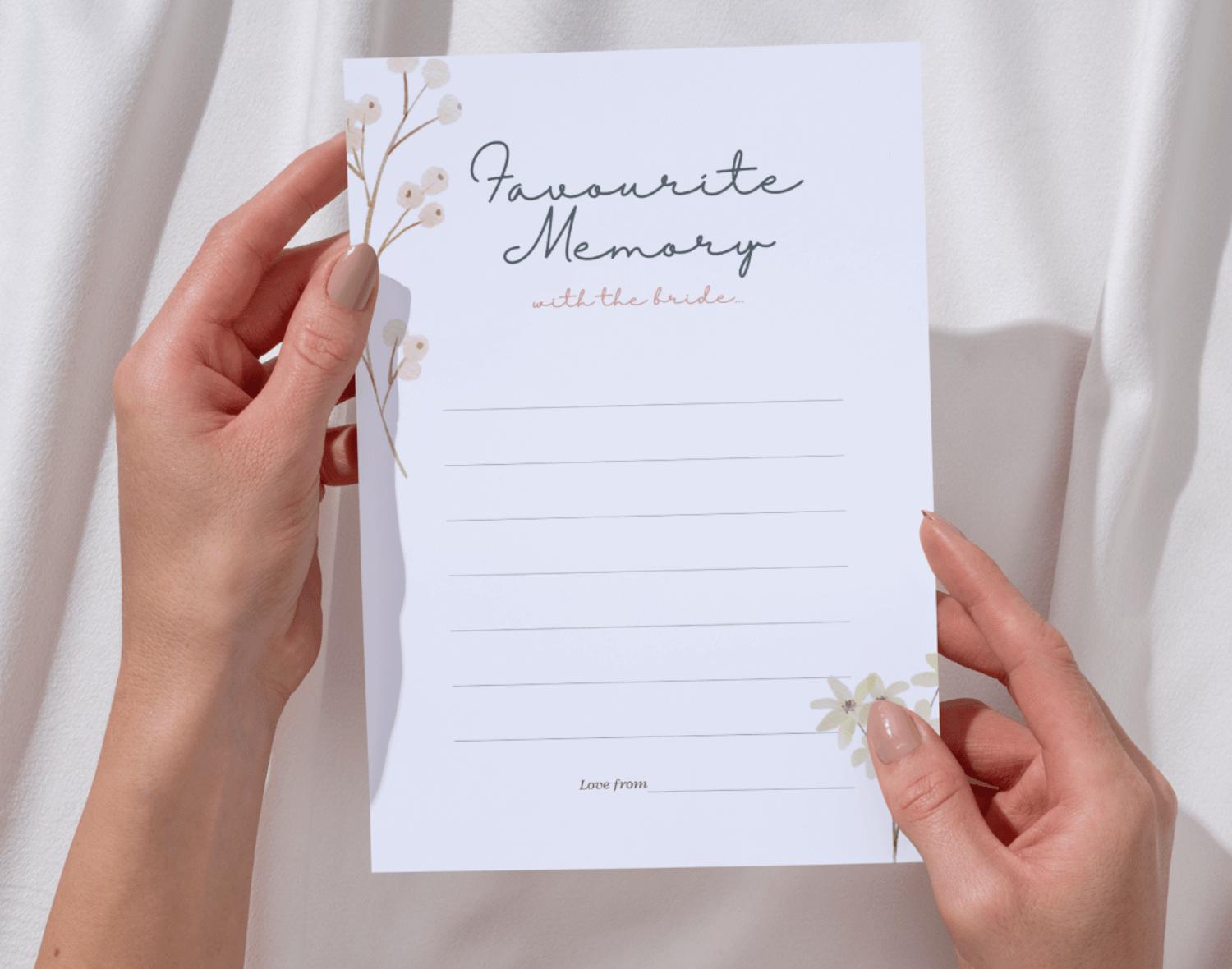 Two hands holding a 'favourite memory with the bride' card with a white background.