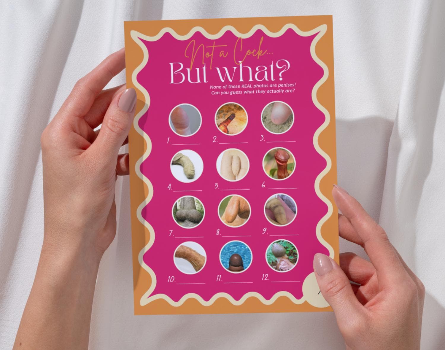 One naughty bachelorette party game card in retro pink held by two hands against a white background.