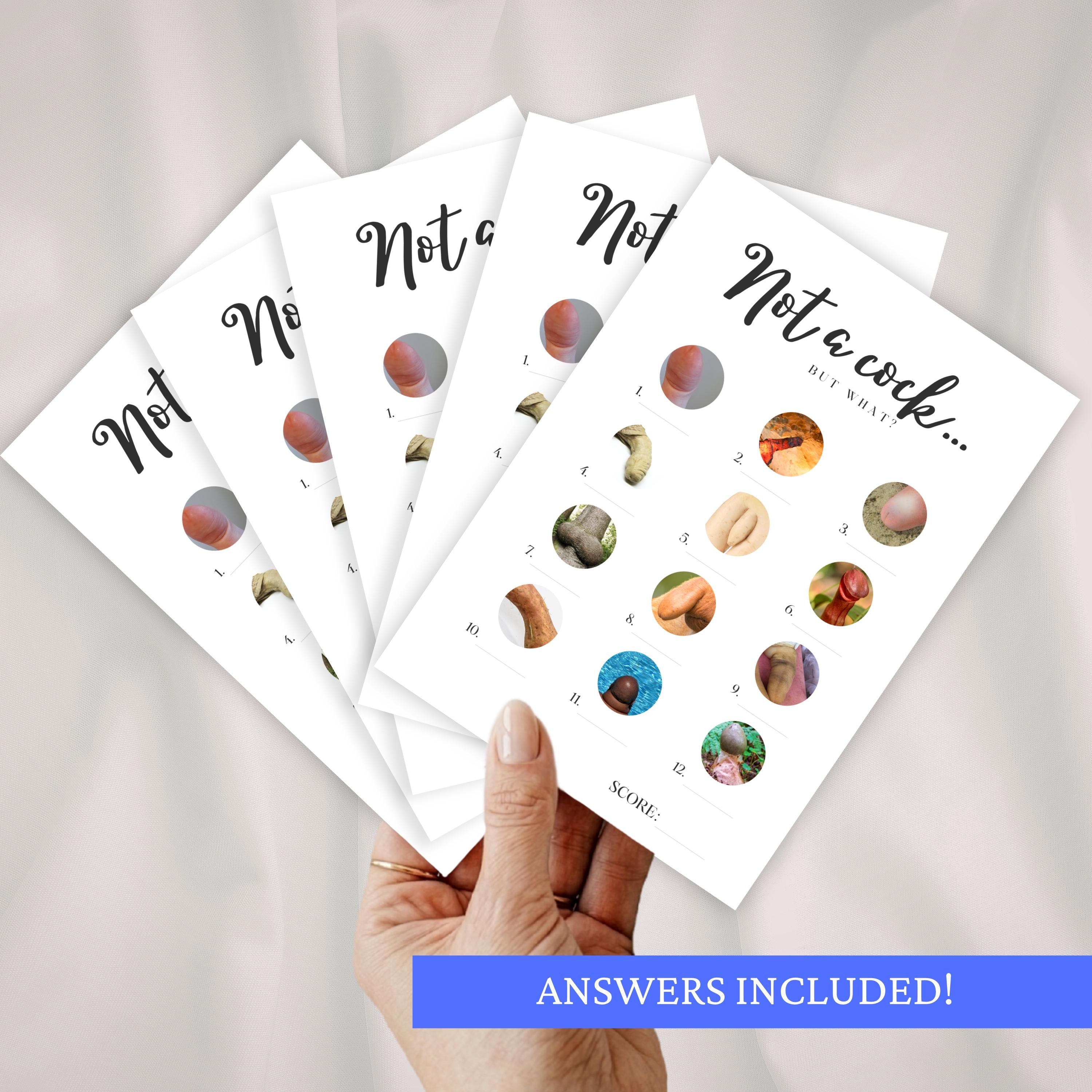 One hand holding multiple cheeky bachelorette party game sheets for hen parties on a white background.