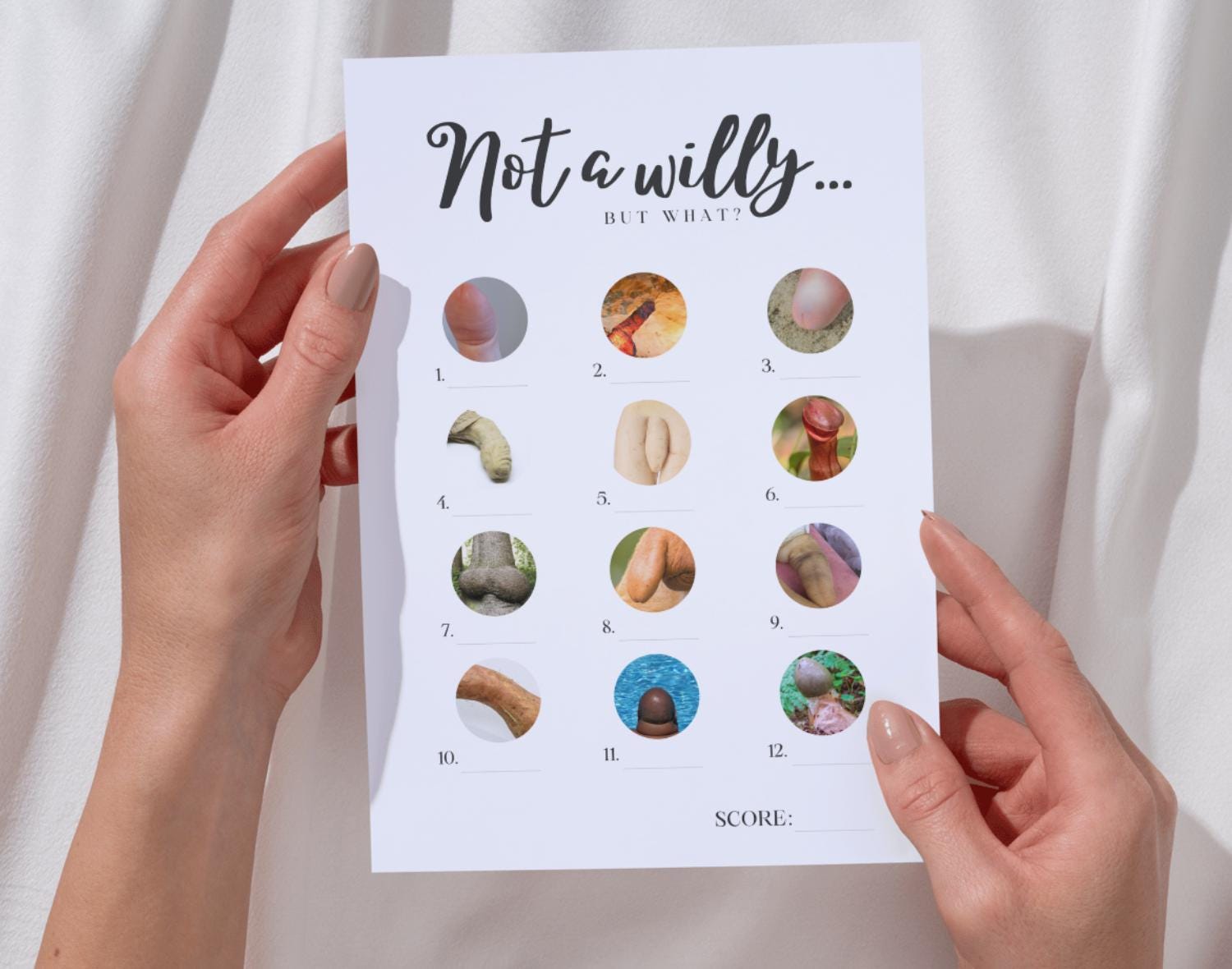 Two hands holding a 'Willy or what'-style hen party game against a white background.