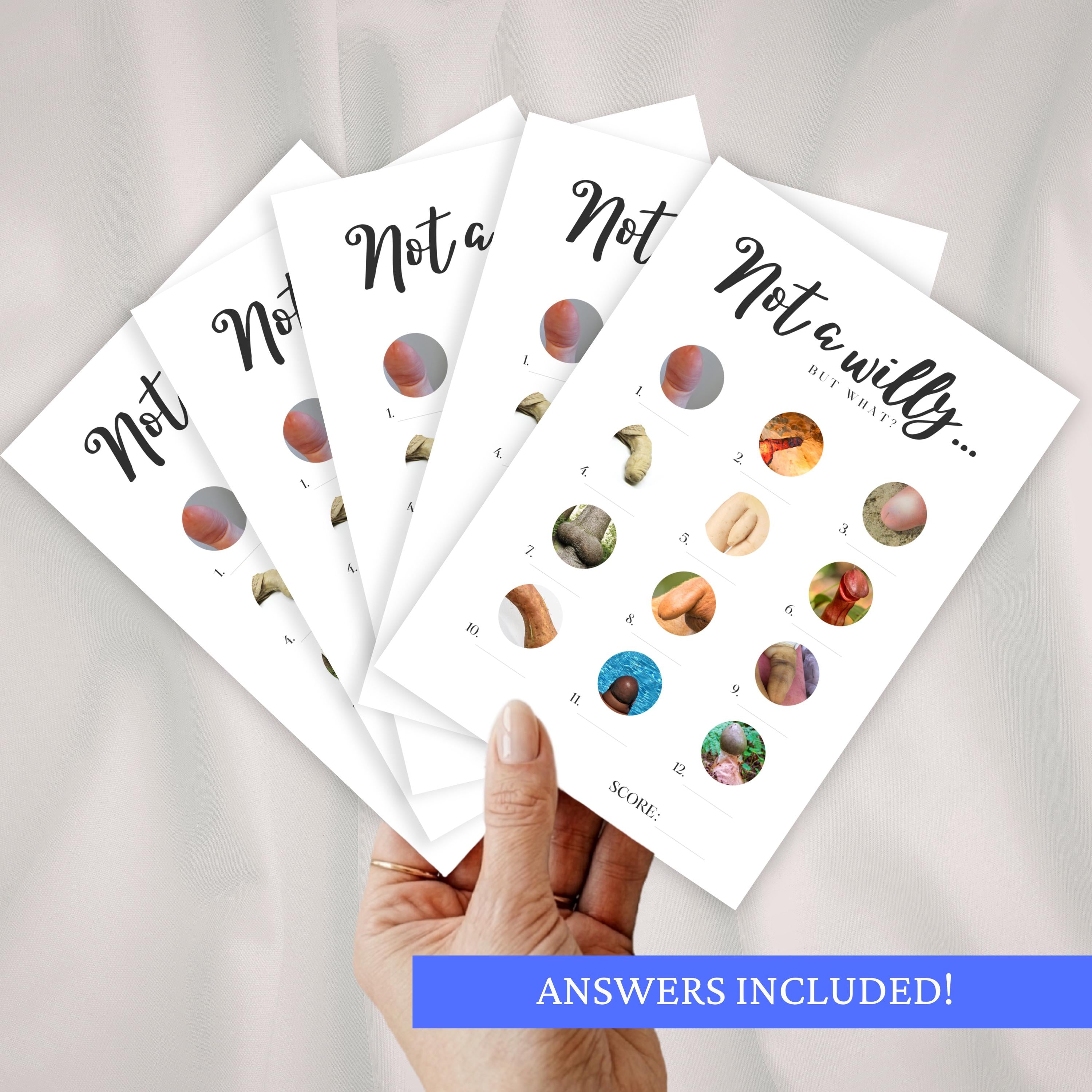 One hand holding multiple 'Willy or what'-style hen do games against a white background.