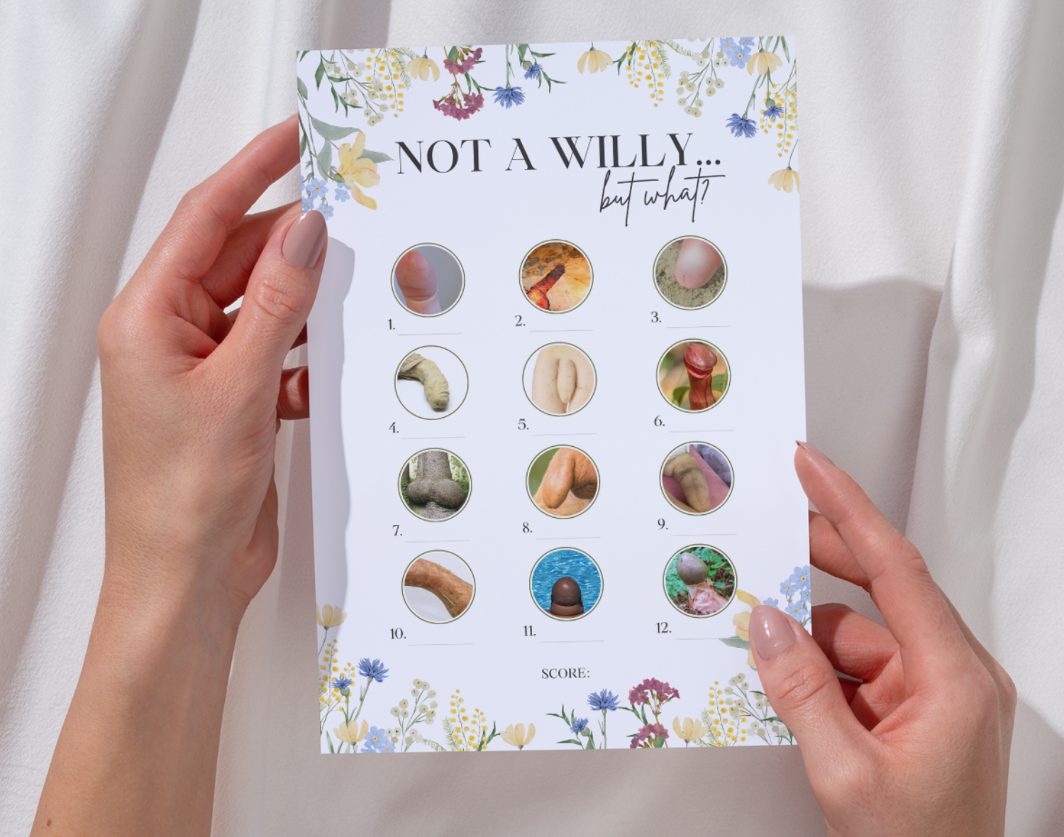 A hand holding a 'Willy or what'-style hen do game card against a white background.