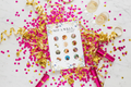 A 'Willy or what'-style hen do game card on a white marble background with hot pink confetti and champagne glasses.